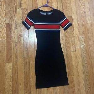 Black with blue, white, and red. Barely been worn. Well fitted.